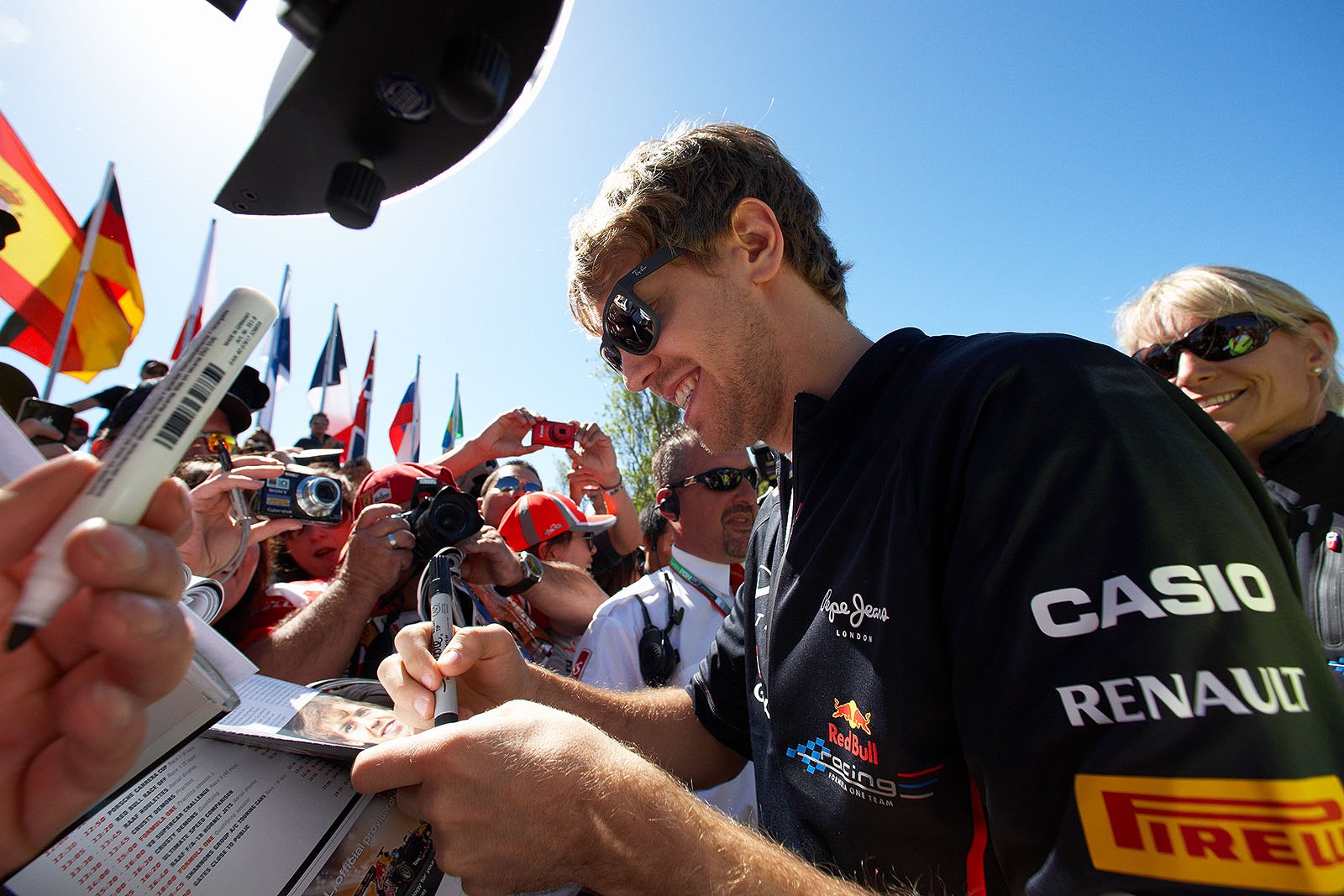Double World Champion Sebastian Vettel gives autographs on race day