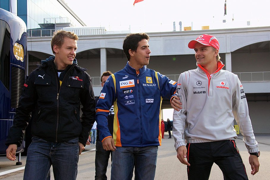 Sebastian Vettel (Toro Rosso), Lucas di Grassi (Renault) and Heikki Kovalainen (McLaren) on their way through paddock after drivers parade