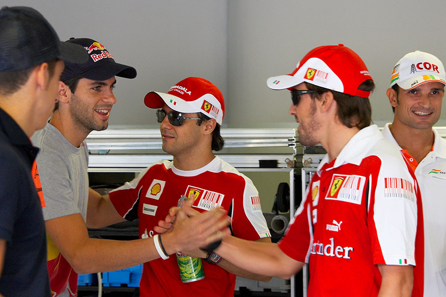 Handshake of the Spaniards Alguersuari and Alonso before drivers parade