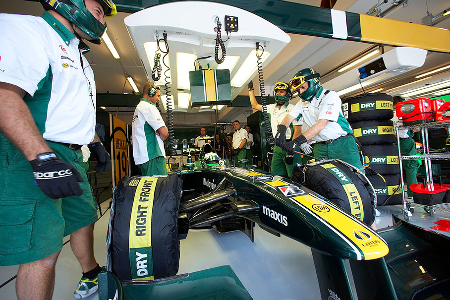 Heikki Kovalainen during practice in Lotus Racing pits