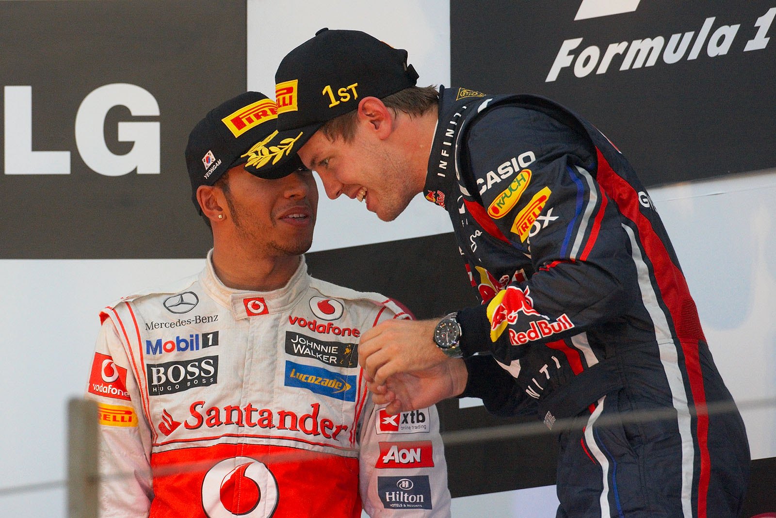 Sebastian Vettel, Red Bull Racing, receives congrats from second placed Lewis Hamilton on the podium after the Korean GP