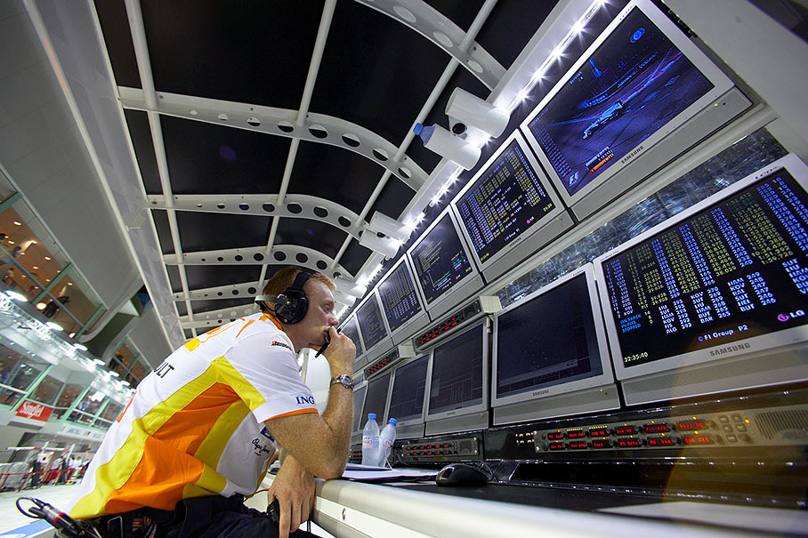 A Renault F1 engineer sits at the pitwall command center