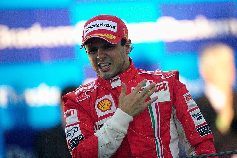 Winner Felipe Massa beats on his heart at Interlagos podium
