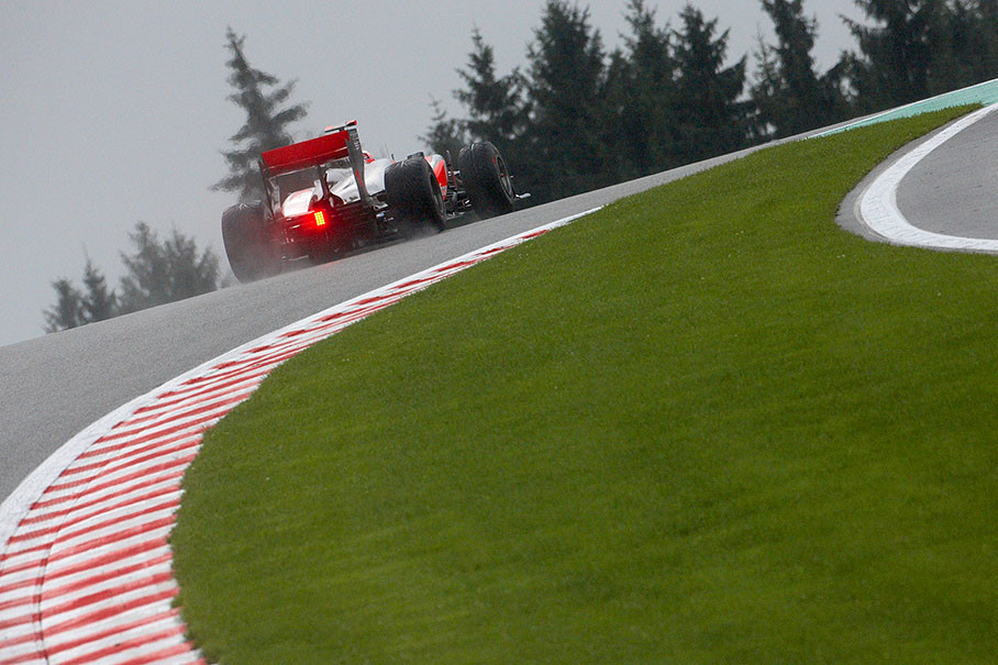 Jenson Button, McLaren Mercedes, climbs the hill behind Eau Rouge