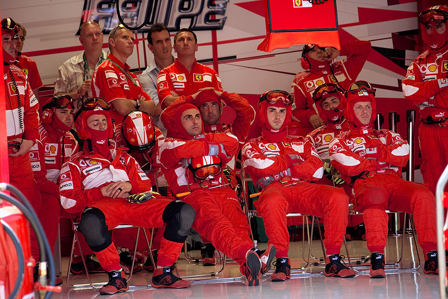 Ferrari mechanics in their pit