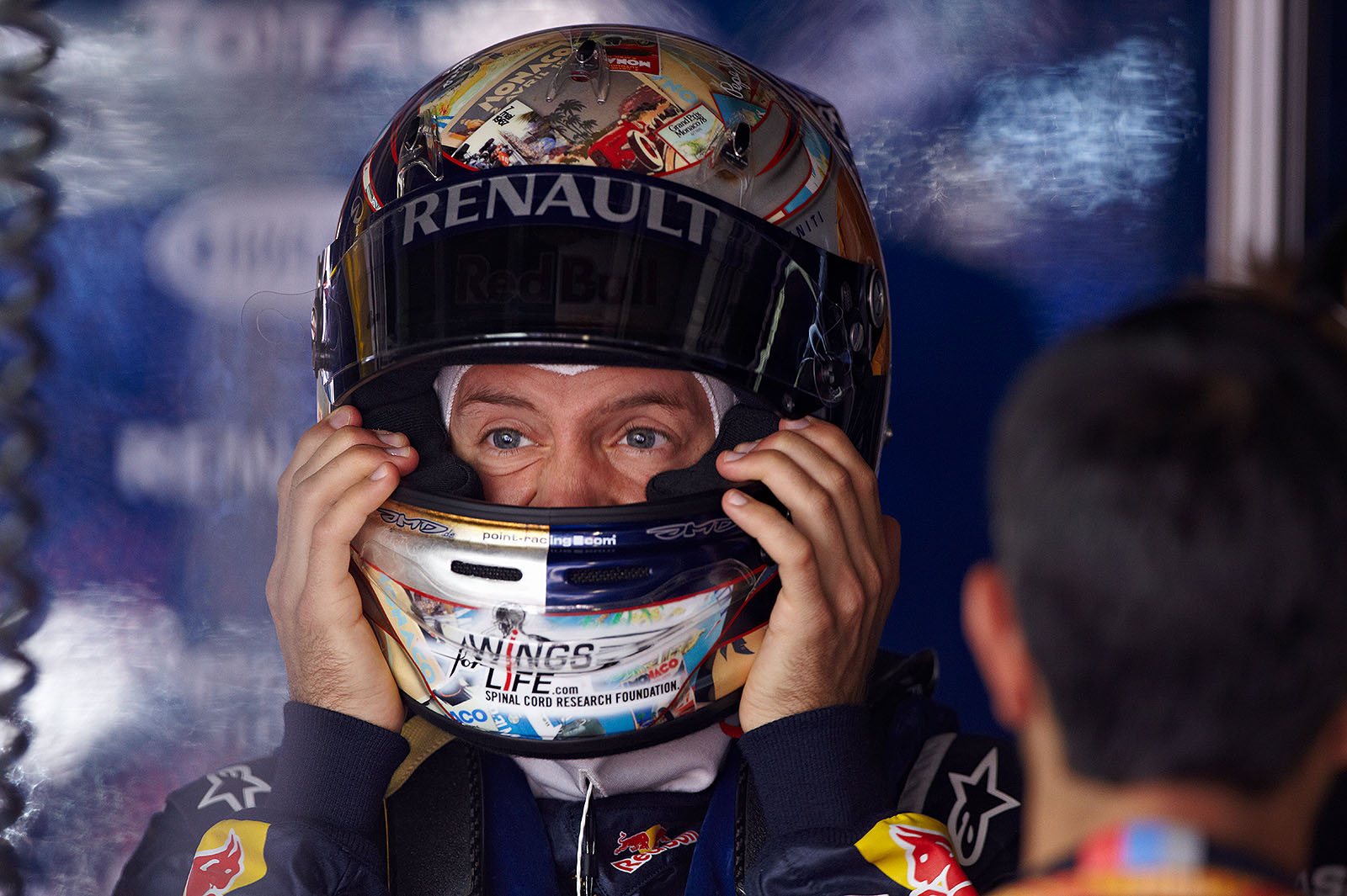 Sebastian Vettel, Red Bull Racing, squeezes his helmet on
