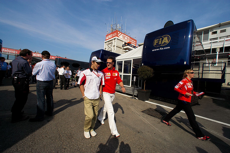 Michael Schumacher with Takuma Sato