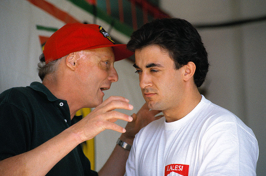 Ferrari advisor Niki Lauda talks to driver Jean Alesi