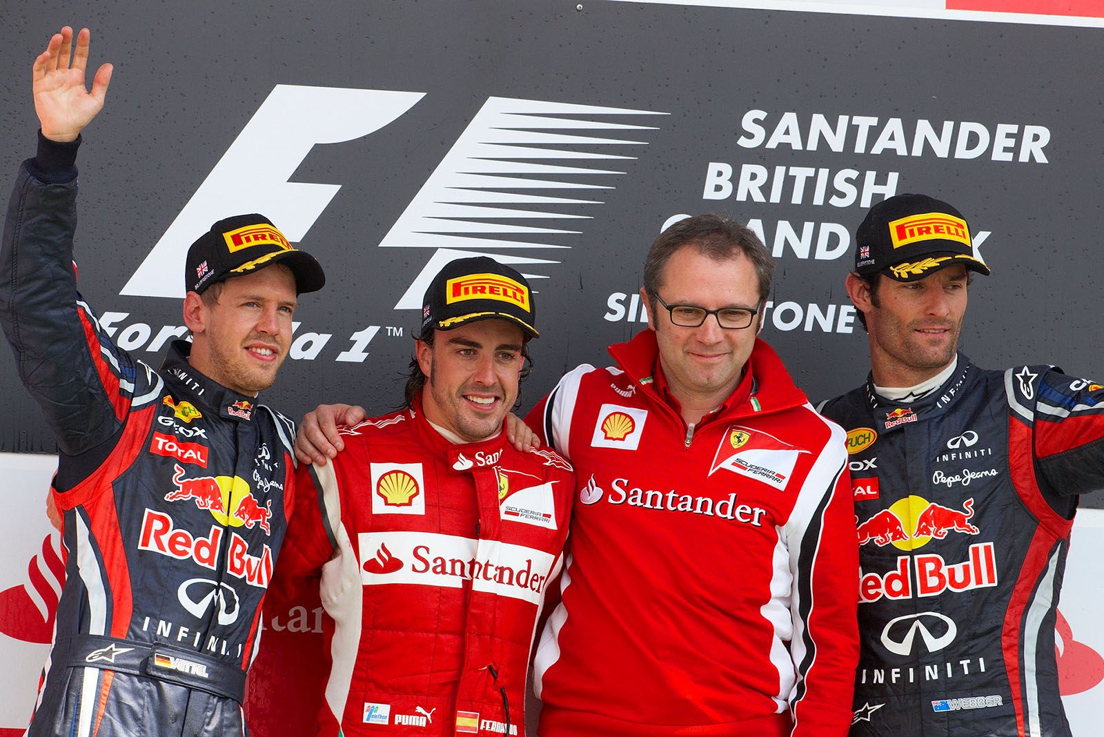 Final podium ceremony group photo of Red Bull's second placed Sebastian Vettel, race winning Fernando Alonso of Ferrari, his team boss Stefano Domenicali and third placed Mark Webber of Red Bull on the podium after the British GP 2011 in Silverstone