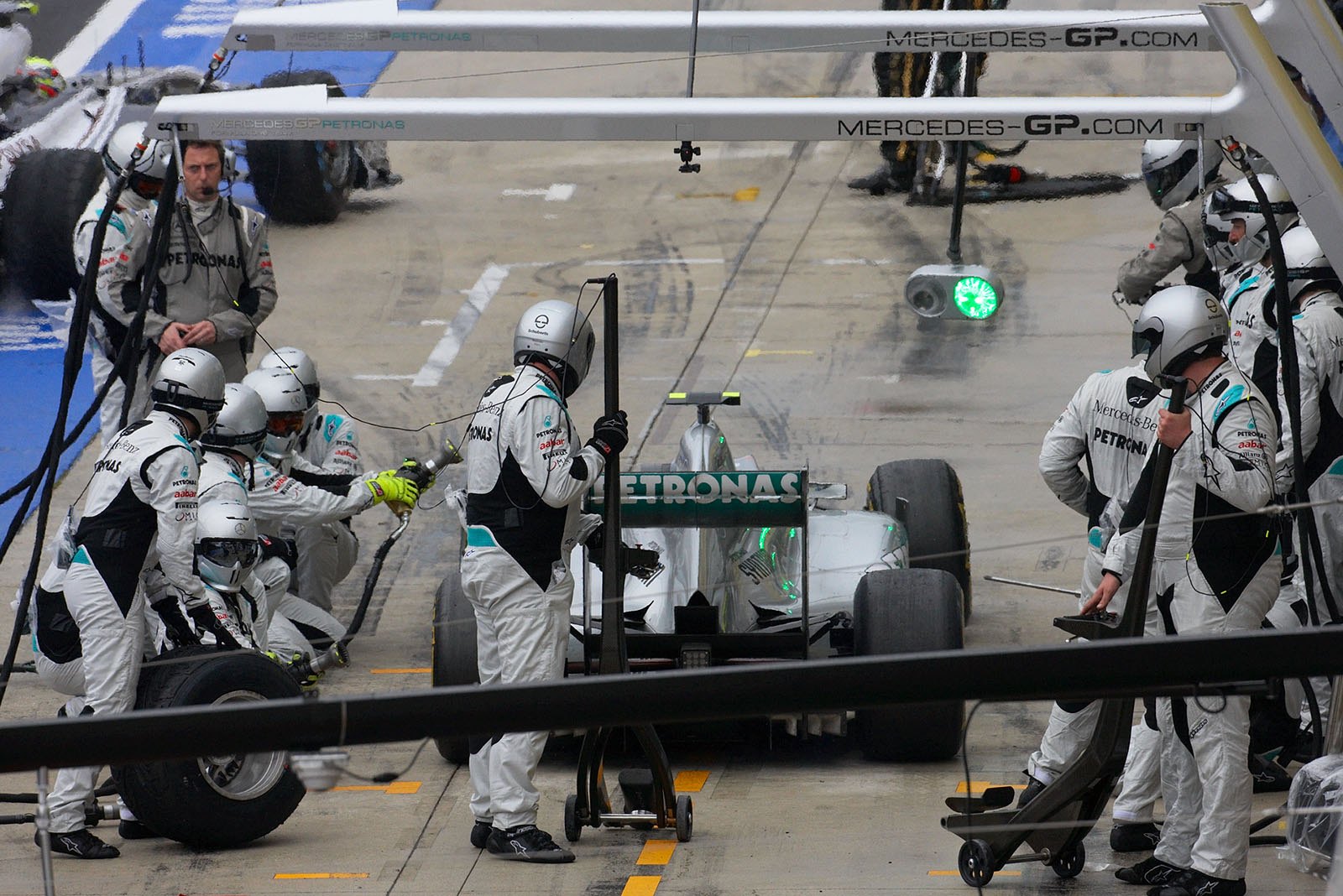 Nico Rosberg ejects from a stop at Mercedes GP pits