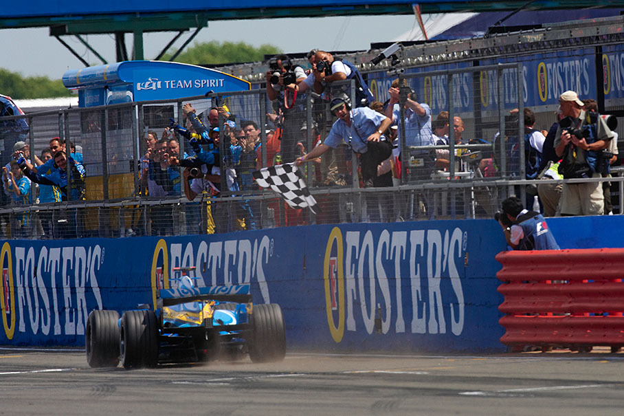 Fernando Alonso passing chequered flag