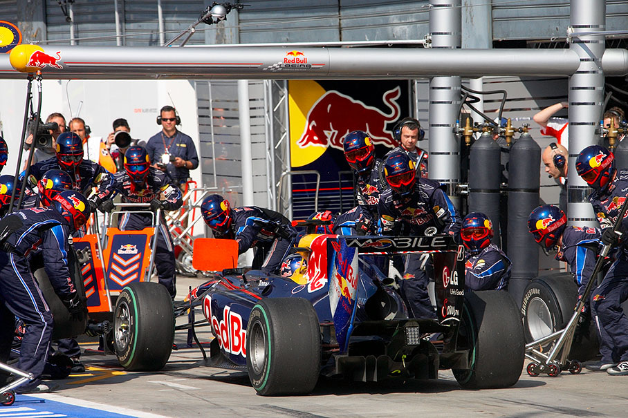 Sebastian Vettel performes his mandatory stop at Red Bull Racing pits one lap before the end of the race for the change from option to prime tyres