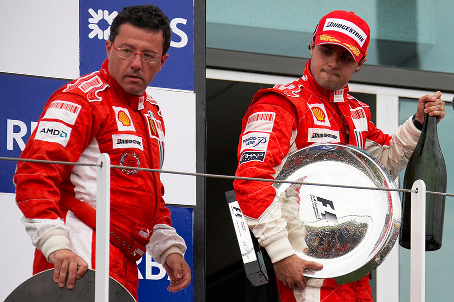 Ferrari's sporting director Luca Baldisserri and winner Massa leave the podium