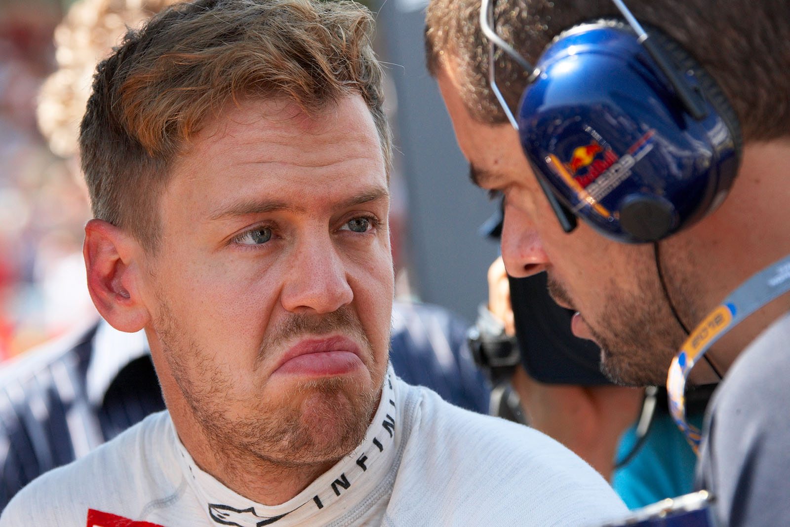 Sebastian Vettel speaks with his Red Bull Racing race engineer Guillaume Rocquelin
