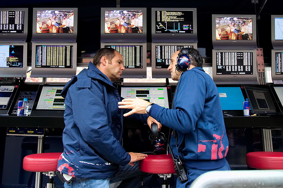 Toro Rosso bosses Gerhard Berger and Franz Tost discussing at their pit wall command center