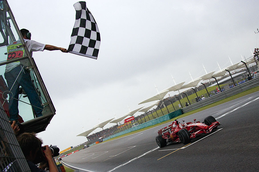 Kimi Raikkonen takes the checquered flag and wins the Chinese Grand Prix
