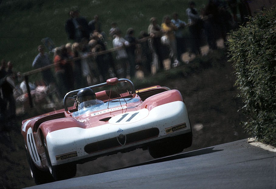 The jumping Alfa Romeo T33/3 #75080-009 of Andrea de Adamich (I) and Henri Pescarolo (F)